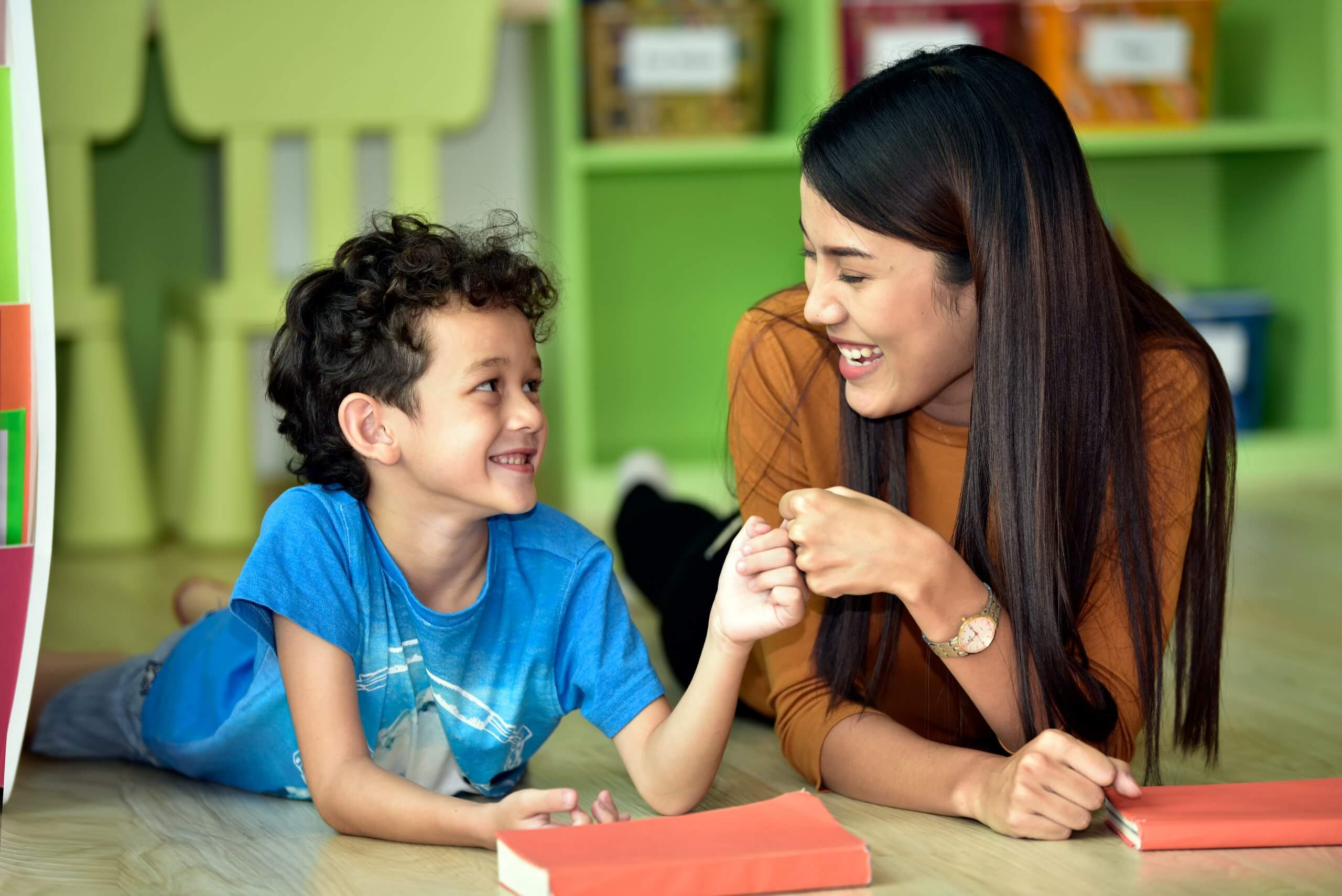 Teacher,And,Kindergarten,Student,Having,Fun,On,Learning,In,An