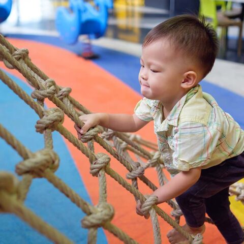 toddler playing at sensory friendly play gym